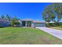 Well maintained home with a two-car garage and lush lawn at 6629 Pleasant Hill Rd, Bradenton, FL 34203