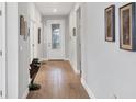 Bright entryway with wood-look floors and a decorative frog statue at 17531 Colebrook Cir, Lakewood Ranch, FL 34202