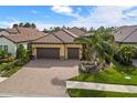 Luxury home with a two-car garage and a spacious backyard at 224 Corelli Dr, Nokomis, FL 34275