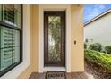 Modern front door with a decorative glass insert and a welcoming 