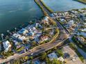 High-angle view of a waterfront home nestled within a lush, coastal community at 451 Bowdoin Cir, Sarasota, FL 34236