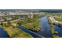 Panoramic aerial view of the riverfront community showcasing water access and lush landscaping at 5611 Key West Pl # 5611, Bradenton, FL 34203