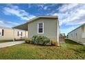 Attractive one-story home with carport and wooden staircase at 6824 Haawi Ct, North Port, FL 34287