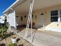 Covered patio with seating and decorative seahorse art at 80 3Rd Ave, Venice, FL 34285