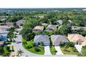 Aerial view of a house on a tree-lined street at 8334 Sailing Loop, Lakewood Ranch, FL 34202