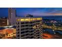 An exterior view of a luxury condominium at twilight with city views at 1255 N Gulfstream Ave # Ph1501, Sarasota, FL 34236