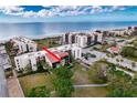 Aerial view of condo building near beach, highlighting unit location at 1935 Gulf Of Mexico Dr # G7-302, Longboat Key, FL 34228