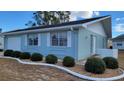 Front exterior view of a single-story home with a one-car garage at 214 Genet Ct, Sun City Center, FL 33573