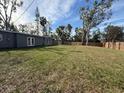 Spacious backyard with a wooden privacy fence at 4007 Asbury Pl, Sarasota, FL 34233