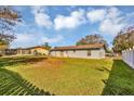 Spacious backyard with a white picket fence, perfect for outdoor activities at 4064 Velarde Ln, Sarasota, FL 34235