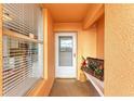 Condo entryway with white door and decorative elements at 4550 Pinebrook Cir # 304, Bradenton, FL 34209