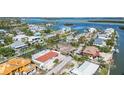 High-angle view of a neighborhood with canals and waterfront homes at 579 Bayview Dr, Longboat Key, FL 34228