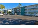 Building exterior showcasing parking and landscaping at 5927 17Th W St # A21, Bradenton, FL 34207