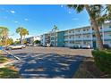 Exterior view of the building and parking area at 5927 17Th W St # A21, Bradenton, FL 34207