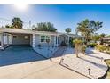 Paved driveway and walkway leading to a charming home entrance at 711 Coquina Ct, Nokomis, FL 34275