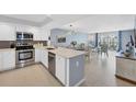 Modern kitchen with stainless steel appliances and white cabinets at 101 S Gulfstream Ave # 15E, Sarasota, FL 34236