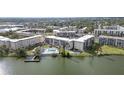Aerial view of condos on the lake, showing a pool and pier for residents to enjoy at 3937 Lake Bayshore Dr # 401, Bradenton, FL 34205
