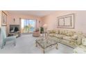 Cozy living room with waterfront view, comfortable furniture and decorative fireplace at 3937 Lake Bayshore Dr # 401, Bradenton, FL 34205