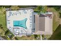 Top-down view of resort-style pool and deck at 3937 Lake Bayshore Dr # 401, Bradenton, FL 34205