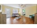 Bright living room featuring hardwood floors and a comfy sofa at 3948 Middlesex Pl, Sarasota, FL 34241