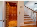Elegant home interior with a wood elevator and staircase at 7007 Holmes Blvd, Holmes Beach, FL 34217