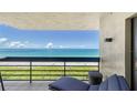 Relaxing ocean view from balcony with lounge chair at 1055 Gulf Of Mexico Dr # 504, Longboat Key, FL 34228