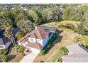 An aerial view showcasing a two-story home with screened-in pool and large backyard at 12342 Lavender Loop, Bradenton, FL 34212