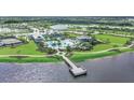 Community amenities including pool, tennis court, pier, and lush green spaces at 17942 Palmiste Dr, Bradenton, FL 34202