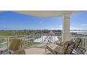 Relaxing balcony with lounge chairs and scenic coastal views at 2050 Benjamin Franklin Dr # B603, Sarasota, FL 34236