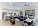 Open concept kitchen and living area with modern appliances and stylish furniture at 4707 Arpino Ct, Bradenton, FL 34211