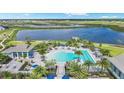 Resort-style pool with lounge chairs and cabanas at 8007 Nevis Run, Bradenton, FL 34202