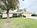 Charming single-story home featuring a well-maintained lawn and an attached one car garage at 1416 Glenmere Dr, Brandon, FL 33511