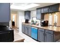 Modern kitchen featuring updated gray cabinetry, countertop appliances and tile flooring at 1416 Glenmere Dr, Brandon, FL 33511