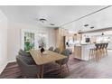 Bright, open kitchen with dining area and stainless steel appliances, perfect for modern living at 2724 Ashton Rd, Sarasota, FL 34231