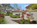 Landscaped pathway leads to the home's entrance at 2910 Longleat Woods, Sarasota, FL 34235