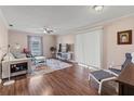 Bright living room featuring hardwood floors and a comfortable sitting area at 3001 Vivienda Blvd, Bradenton, FL 34207