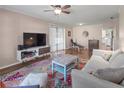 Spacious living room with hardwood floors, a large TV, and comfy furniture at 3001 Vivienda Blvd, Bradenton, FL 34207