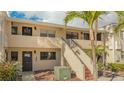 Exterior view of condo building showcasing building features and landscaping at 4621 Gulf Of Mexico Dr # 16B, Longboat Key, FL 34228