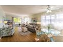 Inviting living room with comfortable seating, natural light, and coastal-themed decor at 4705 5Th W St # 306, Bradenton, FL 34207