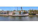 Scenic waterfront view of the property with a private dock at 5055 N Beach Rd # 108, Englewood, FL 34223