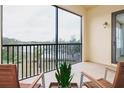 Relaxing screened balcony overlooking lake view at 7702 Lake Vista Ct # 306, Lakewood Ranch, FL 34202