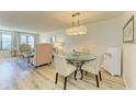 Charming dining area with glass table and four chairs at 141 Wild Palm Dr, Bradenton, FL 34210