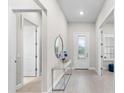 Modern entryway with a console table and mirror at 17714 Waterville Pl, Bradenton, FL 34202