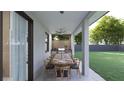 Outdoor kitchen and dining area with ceiling fan at 18040 Quincy Ave, Port Charlotte, FL 33948