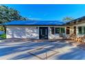 Front porch with rocking chairs and a double door entry at 2160 17Th W St, Palmetto, FL 34221