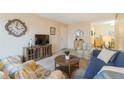 Living room with a blue sofa and patterned armchairs at 3267 S Beneva Rd # 103, Sarasota, FL 34232