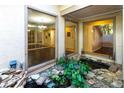 Peaceful courtyard with a small pond and lush greenery at 5131 Willow Leaf Dr, Sarasota, FL 34241