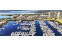 Aerial view of a marina filled with boats and waterfront property at 606 Riviera Dunes Way # 404, Palmetto, FL 34221