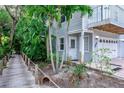 House exterior with walkway leading to the front door at 6250 Holmes Blvd # 32, Holmes Beach, FL 34217