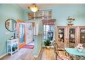 Bright dining room with glass-top table and decorative accents at 9351 Raes Creek Pl, Palmetto, FL 34221